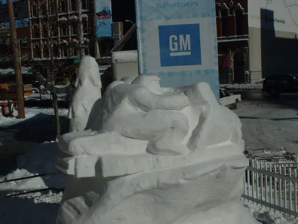 Snowmobiler snow sculpture